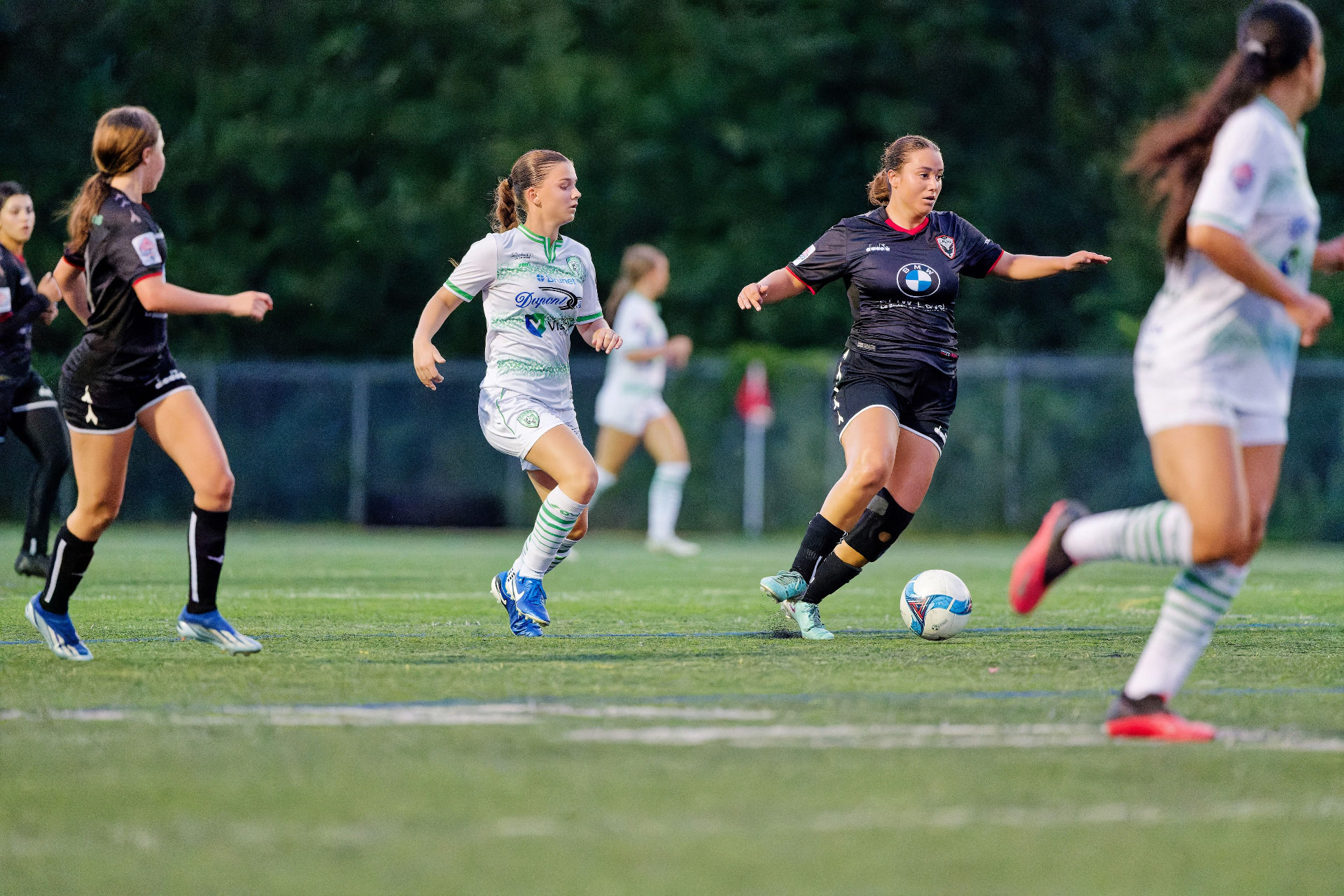 Women's football match at sunset